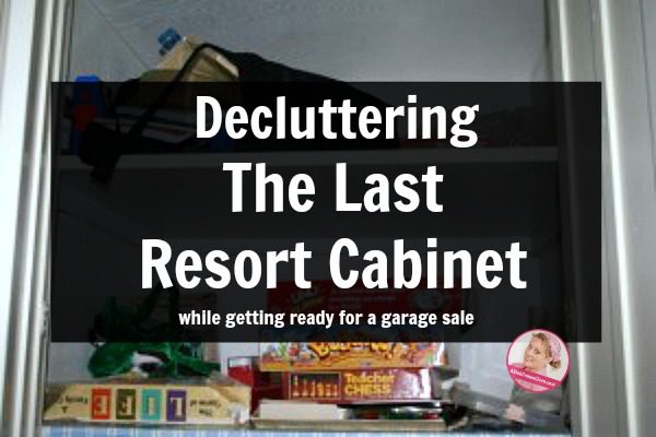 declutter the game cabinet get ready for garage sale at ASlobComesClean.com