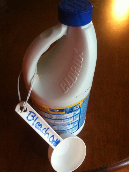 Clorox Concentrated with designated measuring cup attached.