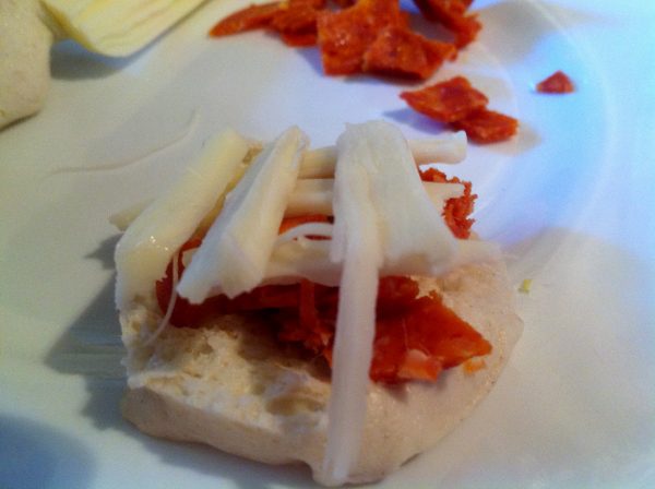 Assembling the Waffle Iron Pizza Pockets