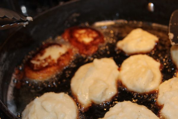 Hot Potato Pancakes Bubbling in Oil at ASlobComesClean.com