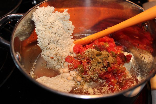 Photo - Using pre-cooked chicken to make White Chicken Chili at ASlobComesClean.com