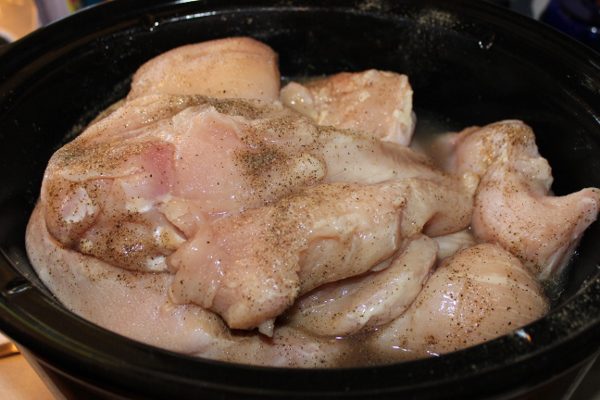 Cooking boneless, skinless chicken breasts in the crockpot in bulk at ASlobComesClean.com