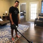 teenager vacuuming with Hoover