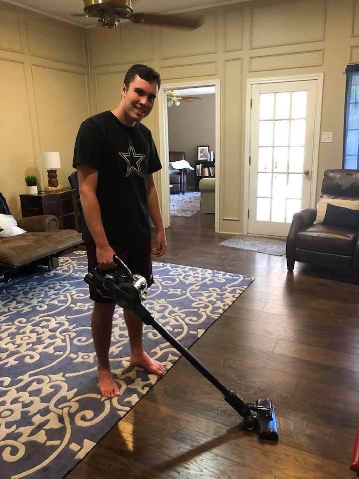 teenager vacuuming with Hoover