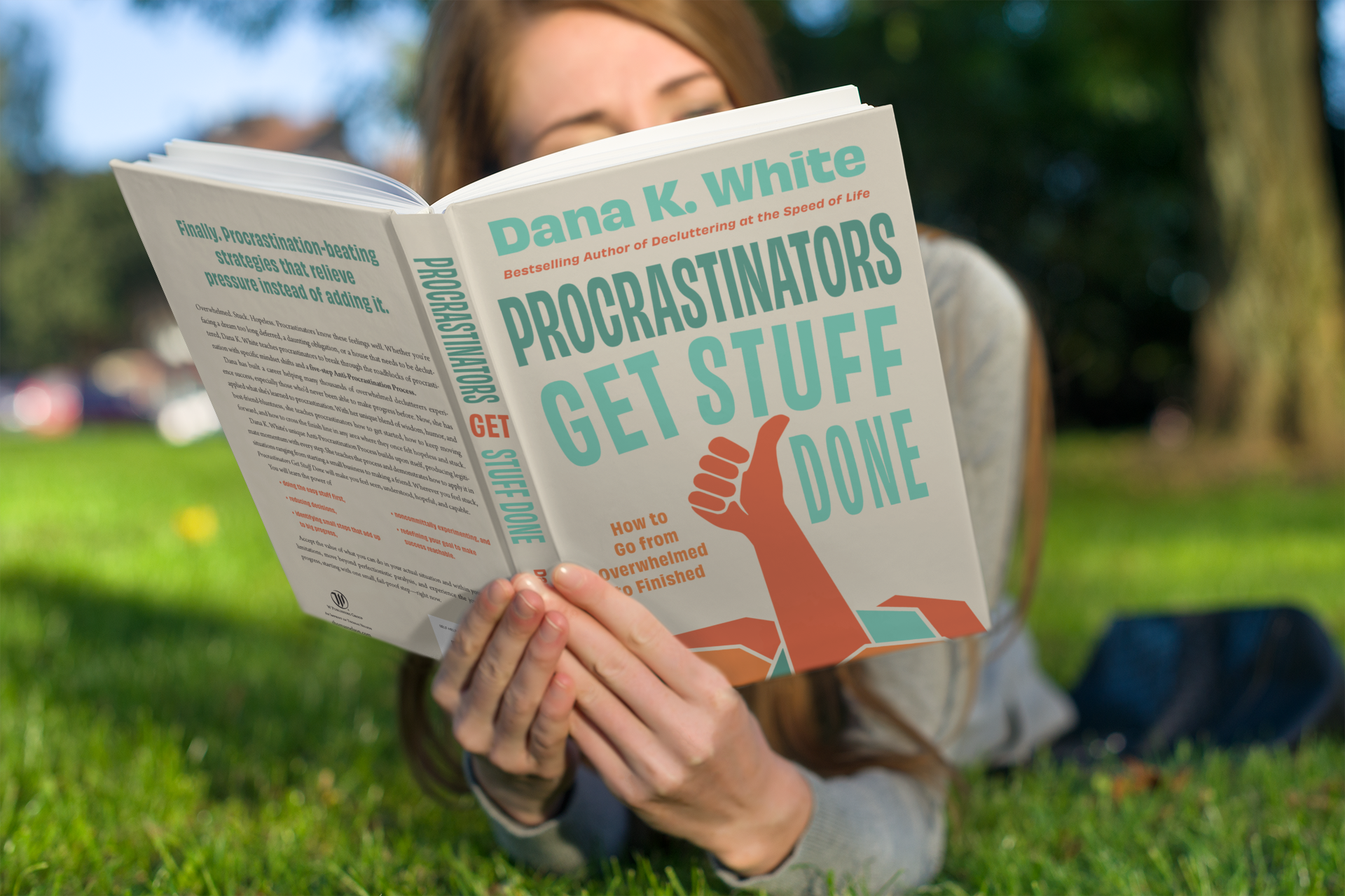 mockup-of-a-woman-reading-a-paperback-book-on-the-grass-3412-el1